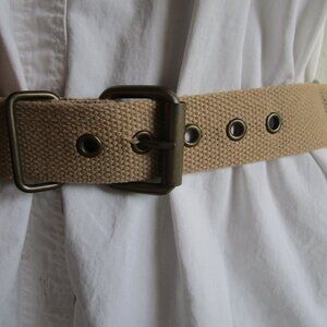 Belt beige tone canvas weave. 27-31 in 1.5 wide, metal stars, loop rings.